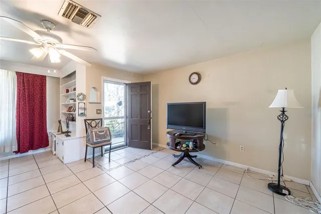 a view of a livingroom with furniture and a flat screen tv