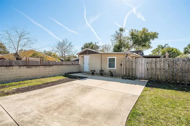 a view of backyard with small garden