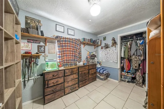a bedroom with furniture and a window