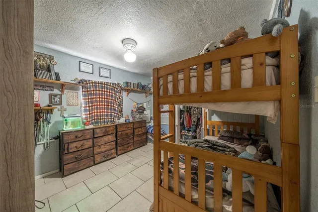 a kitchen with stove and cabinets