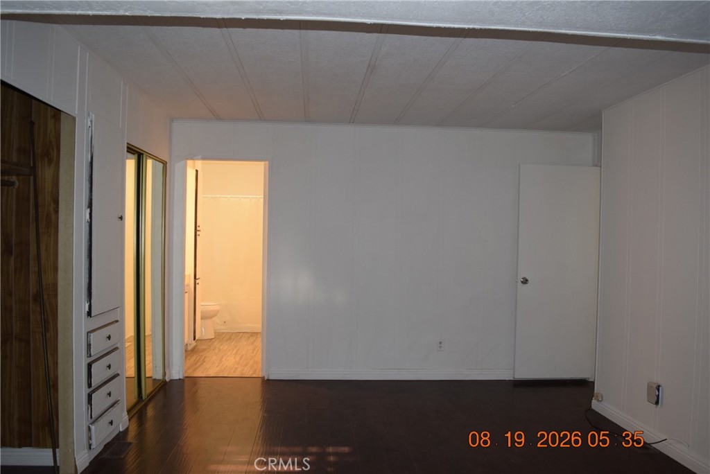 23500 The Old Road, Unit 9 Newhall, CA 91321 - Photo 32 of 56 Primary bedroom view towards the primary restroom.