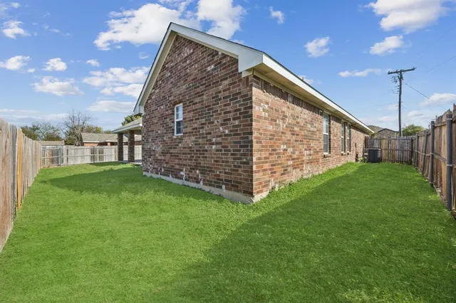 a backyard of a house with lots of green space