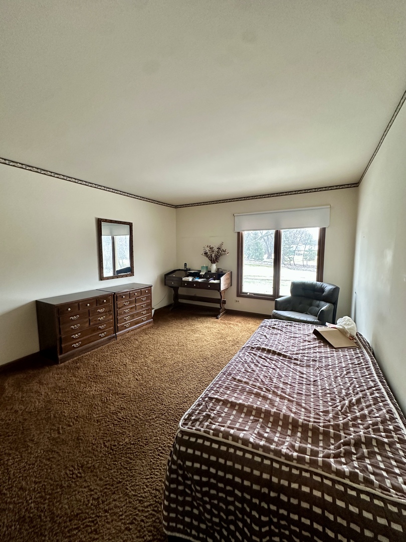 3008 Rennes Court Northbrook, IL 60062 - Photo 24 of 32 a bedroom with a bed and window