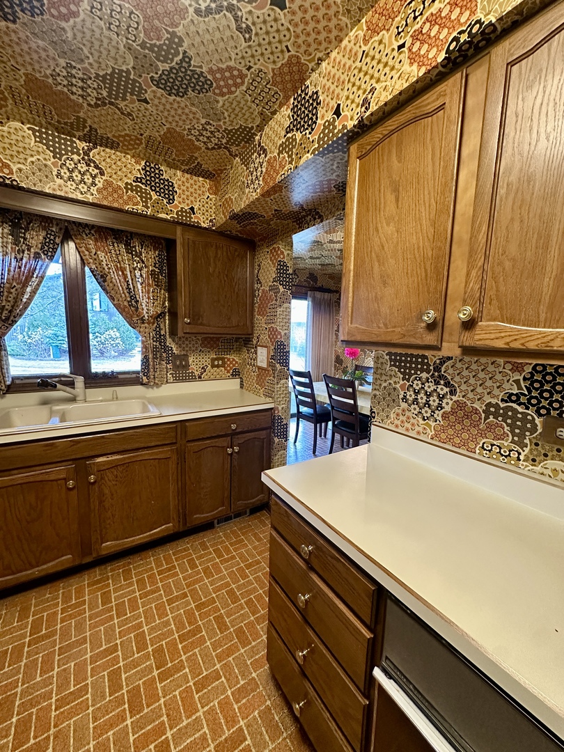 3008 Rennes Court Northbrook, IL 60062 - Photo 5 of 32 a kitchen with a sink a stove and cabinets