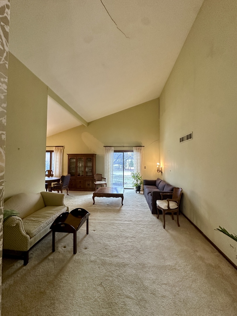 3008 Rennes Court Northbrook, IL 60062 - Photo 10 of 32 a living room with furniture and a fireplace