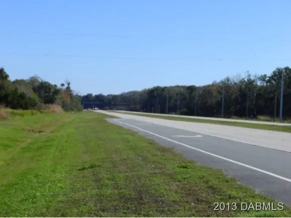 a view of swimming pool with outdoor seating and yard