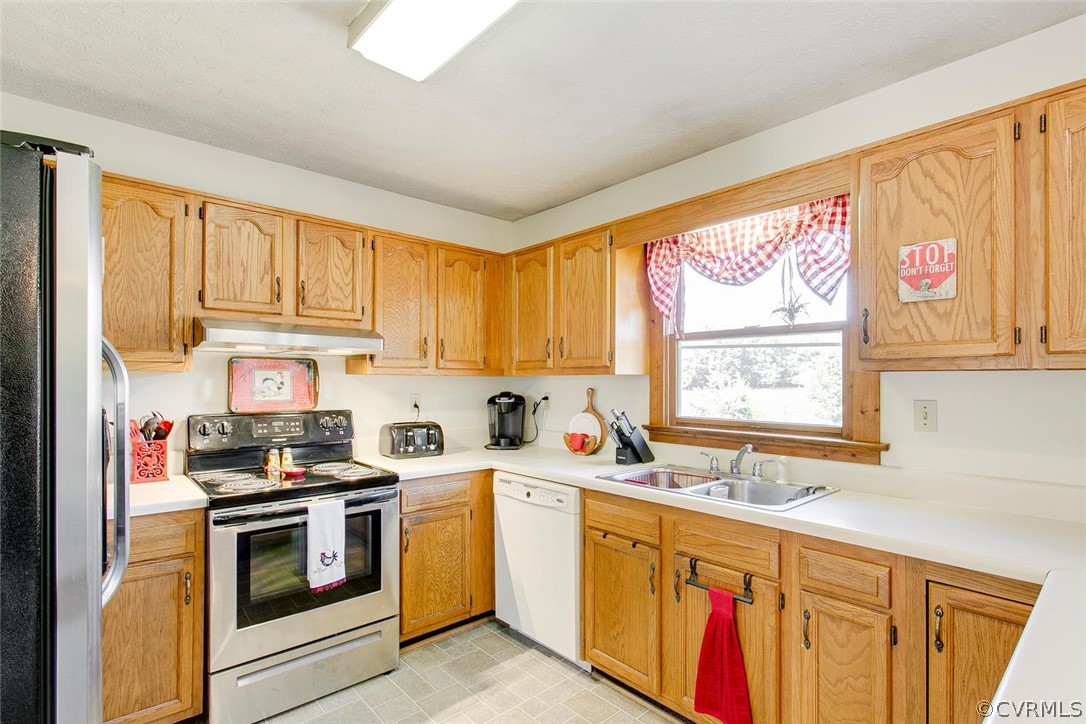13200 Beach Road Chesterfield, VA 23832 - Photo 8 of 30 a kitchen with a sink stove top oven and cabinets