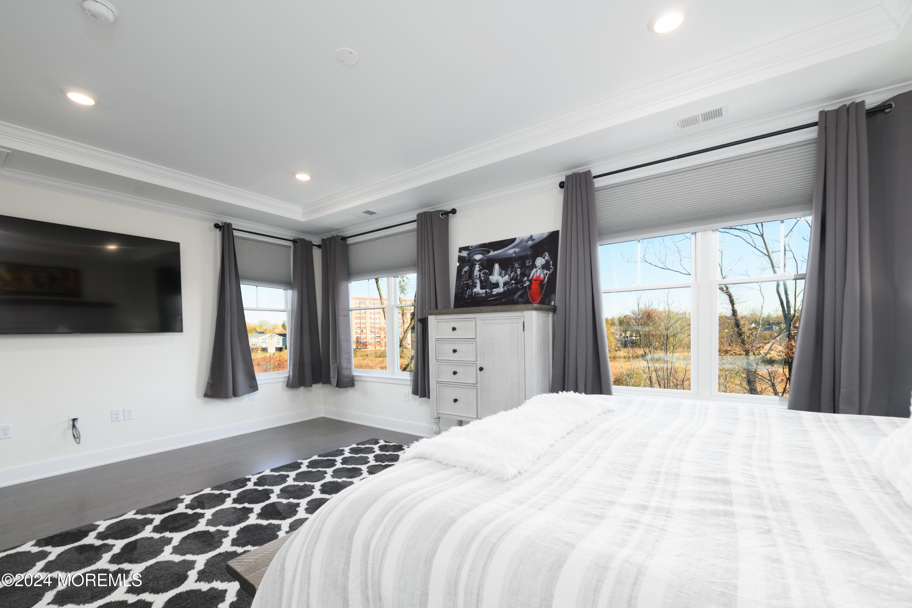 17 Raritan Cove Keyport, NJ 07735 - Photo 14 of 42 a bedroom with a large bed and a flat tv screen on dresser
