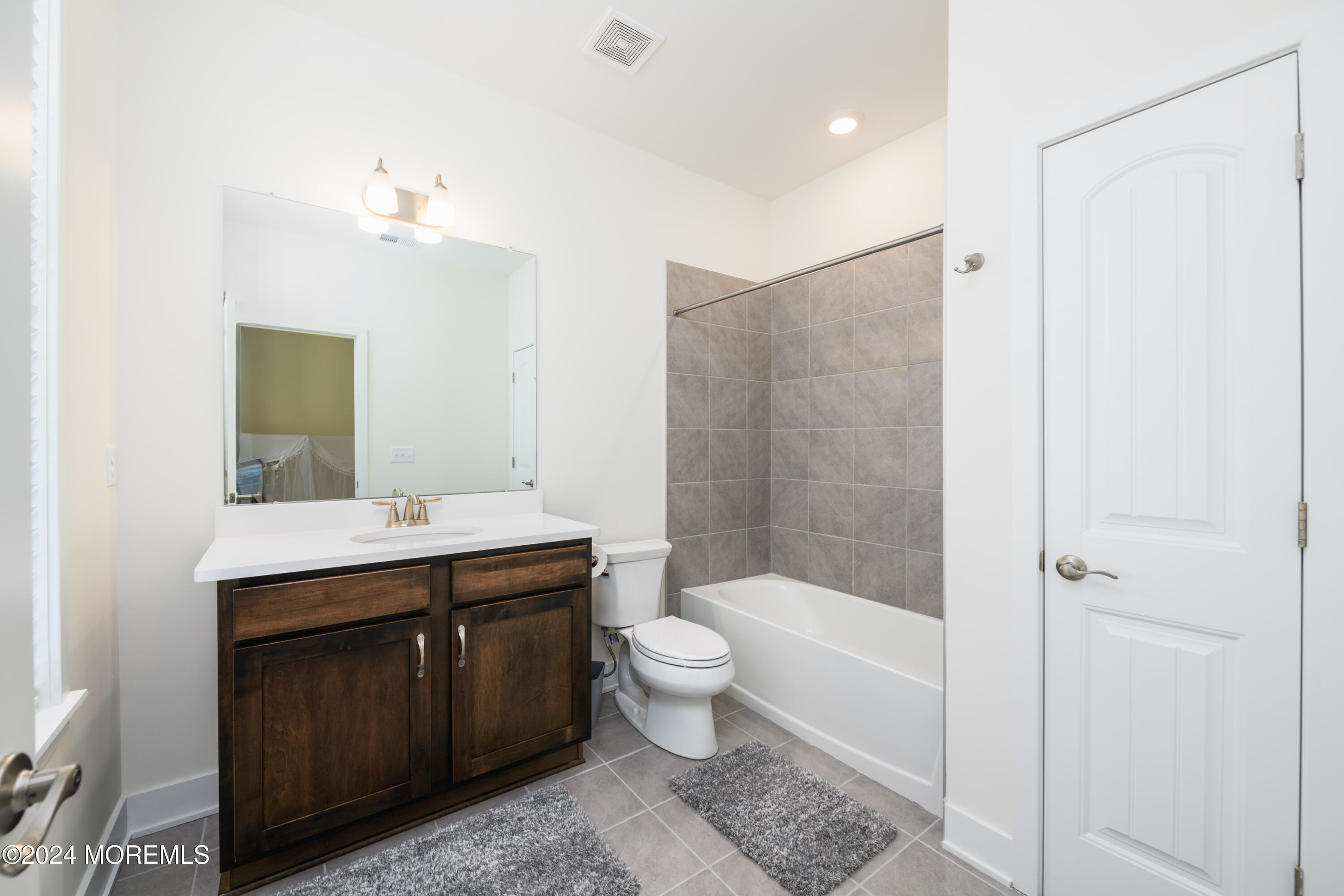 17 Raritan Cove Keyport, NJ 07735 - Photo 17 of 42 a bathroom with a sink a toilet and shower