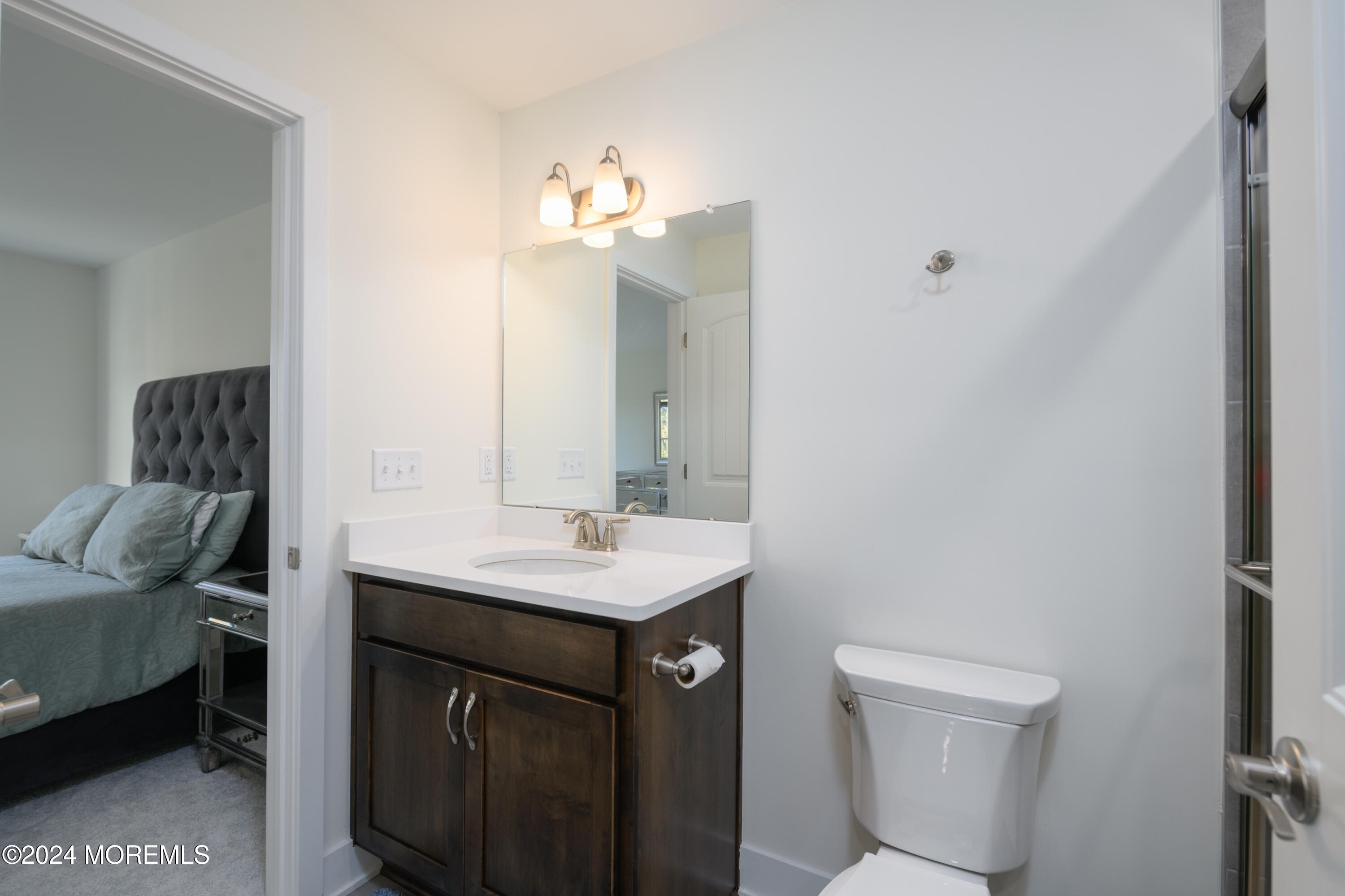 17 Raritan Cove Keyport, NJ 07735 - Photo 21 of 42 a bathroom with a sink a toilet and mirror