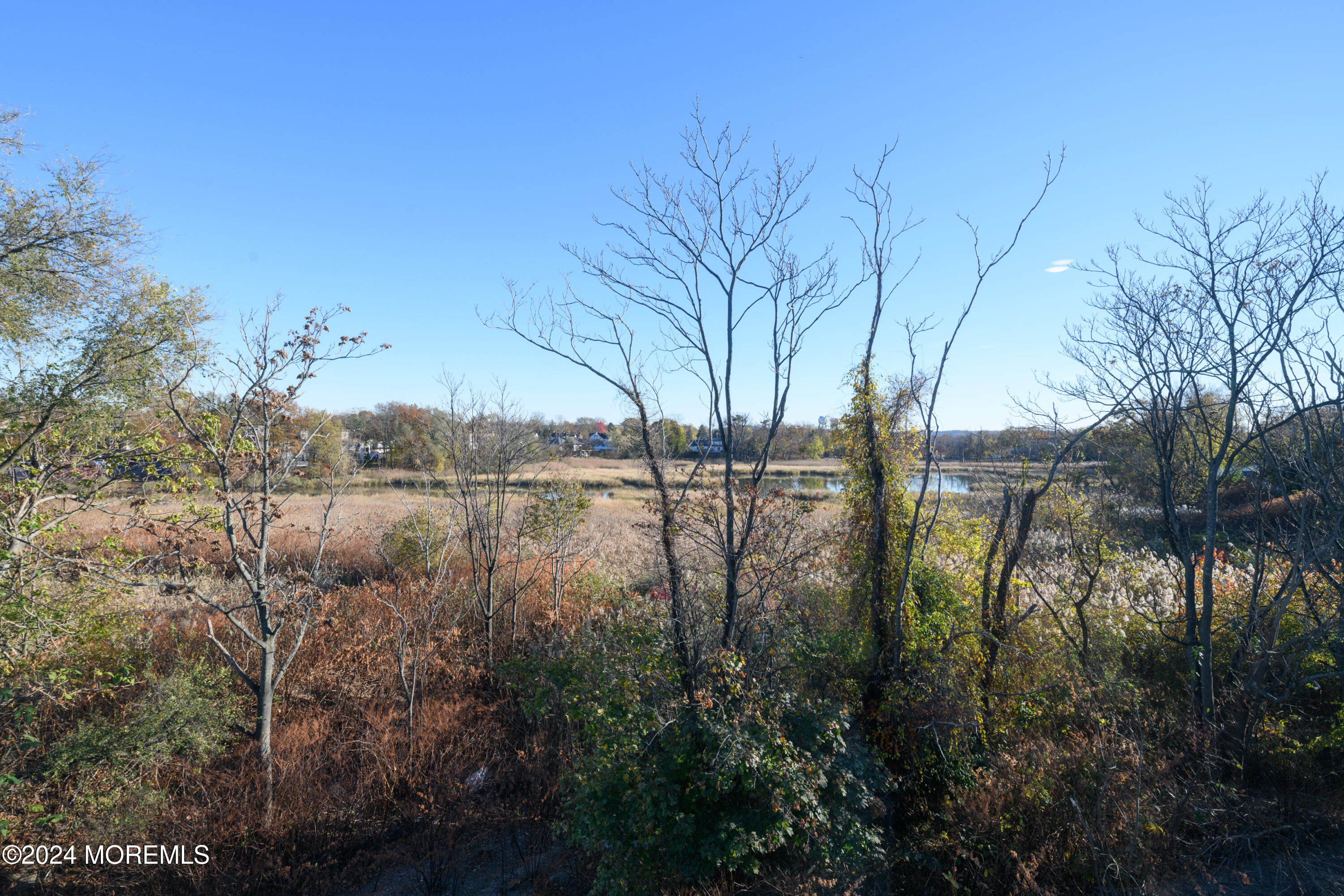 17 Raritan Cove Keyport, NJ 07735 - Photo 27 of 42 a view of lake with a house in background
