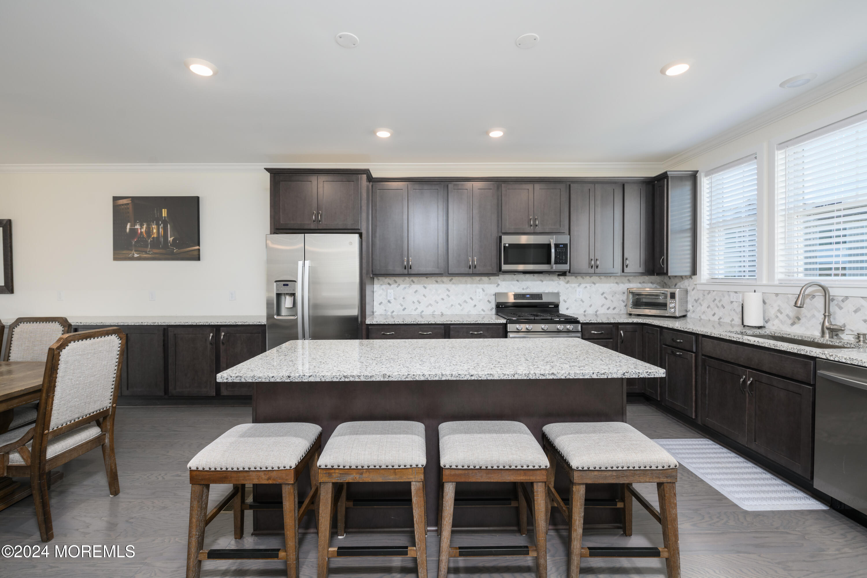 17 Raritan Cove Keyport, NJ 07735 - Photo 8 of 42 a kitchen with a dining table chairs and large window