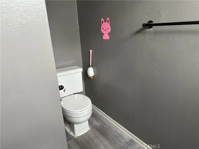 a bathroom with a toilet and a sink