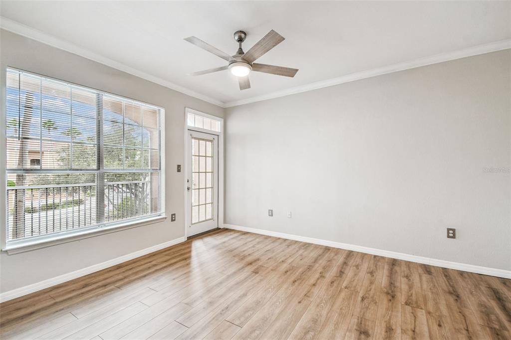 5000 Culbreath Key Way, Unit 1215 Tampa, FL 33611 - Photo 15 of 57 an empty room with wooden floor and windows