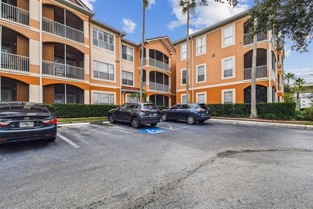 5000 Culbreath Key Way, Unit 1215 Tampa, FL 33611 - Photo 3 of 57 a view of a street with a cars parked in front of a building