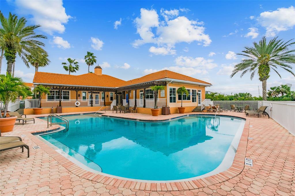 5000 Culbreath Key Way, Unit 1215 Tampa, FL 33611 - Photo 33 of 57 a view of a swimming pool with lounge chair