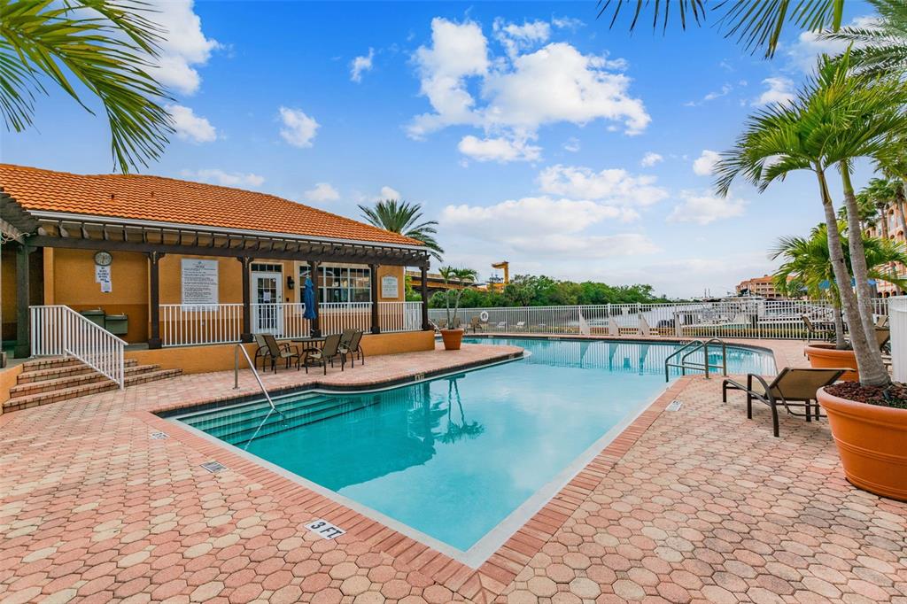 5000 Culbreath Key Way, Unit 1215 Tampa, FL 33611 - Photo 34 of 57 a view of a house with swimming pool and sitting area
