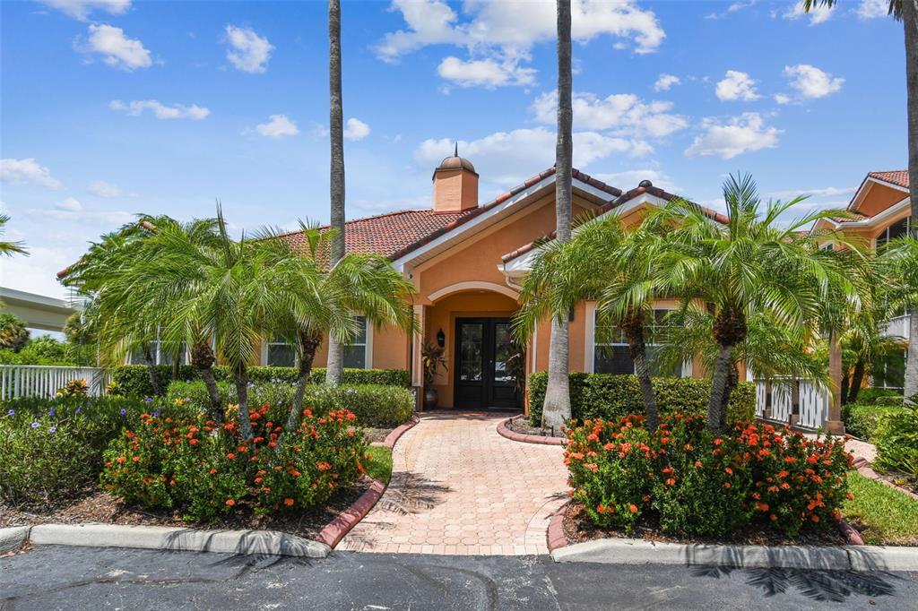 5000 Culbreath Key Way, Unit 1215 Tampa, FL 33611 - Photo 42 of 57 a view of a house with a yard and potted plants