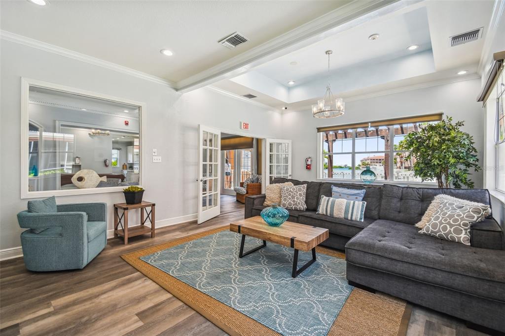 5000 Culbreath Key Way, Unit 1215 Tampa, FL 33611 - Photo 47 of 57 a living room with furniture and a wooden floor
