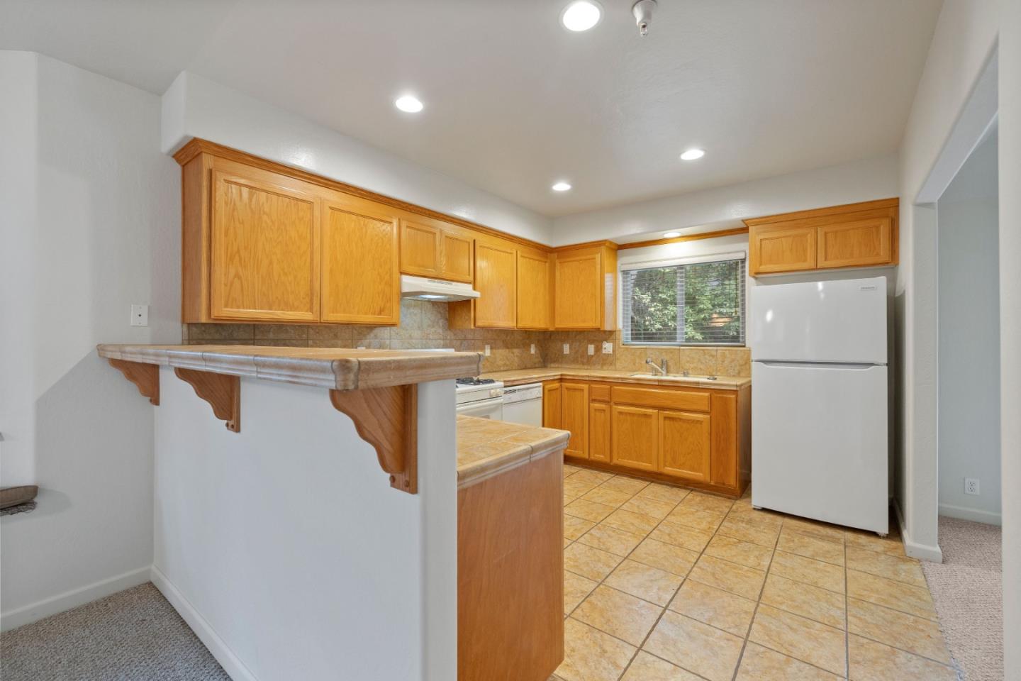 33 Edgewood Way Santa Cruz, CA 95060 - Photo 11 of 37 a kitchen with a refrigerator a sink and dishwasher