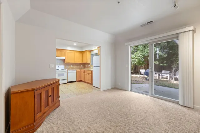 a view of a kitchen with a sink and a window