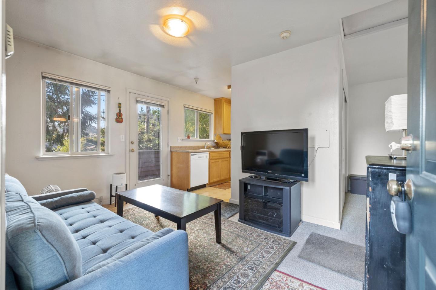 33 Edgewood Way Santa Cruz, CA 95060 - Photo 24 of 37 a living room with furniture and a flat screen tv