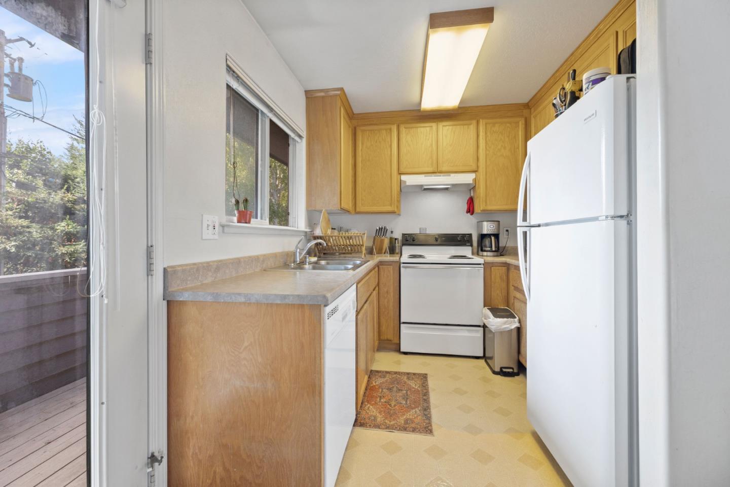 33 Edgewood Way Santa Cruz, CA 95060 - Photo 27 of 37 a kitchen with a sink a refrigerator and window