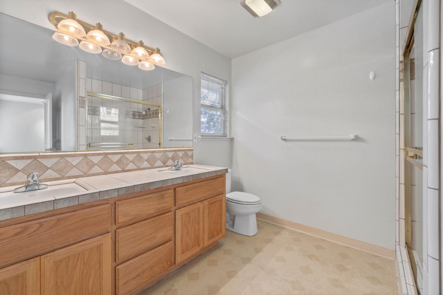 33 Edgewood Way Santa Cruz, CA 95060 - Photo 28 of 37 a bathroom with a toilet sink and mirror
