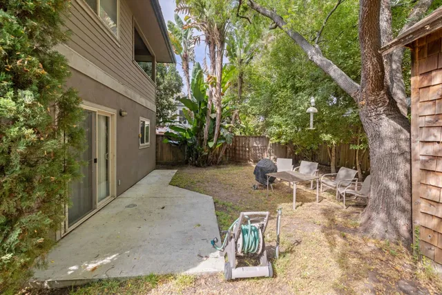 a view of backyard with patio