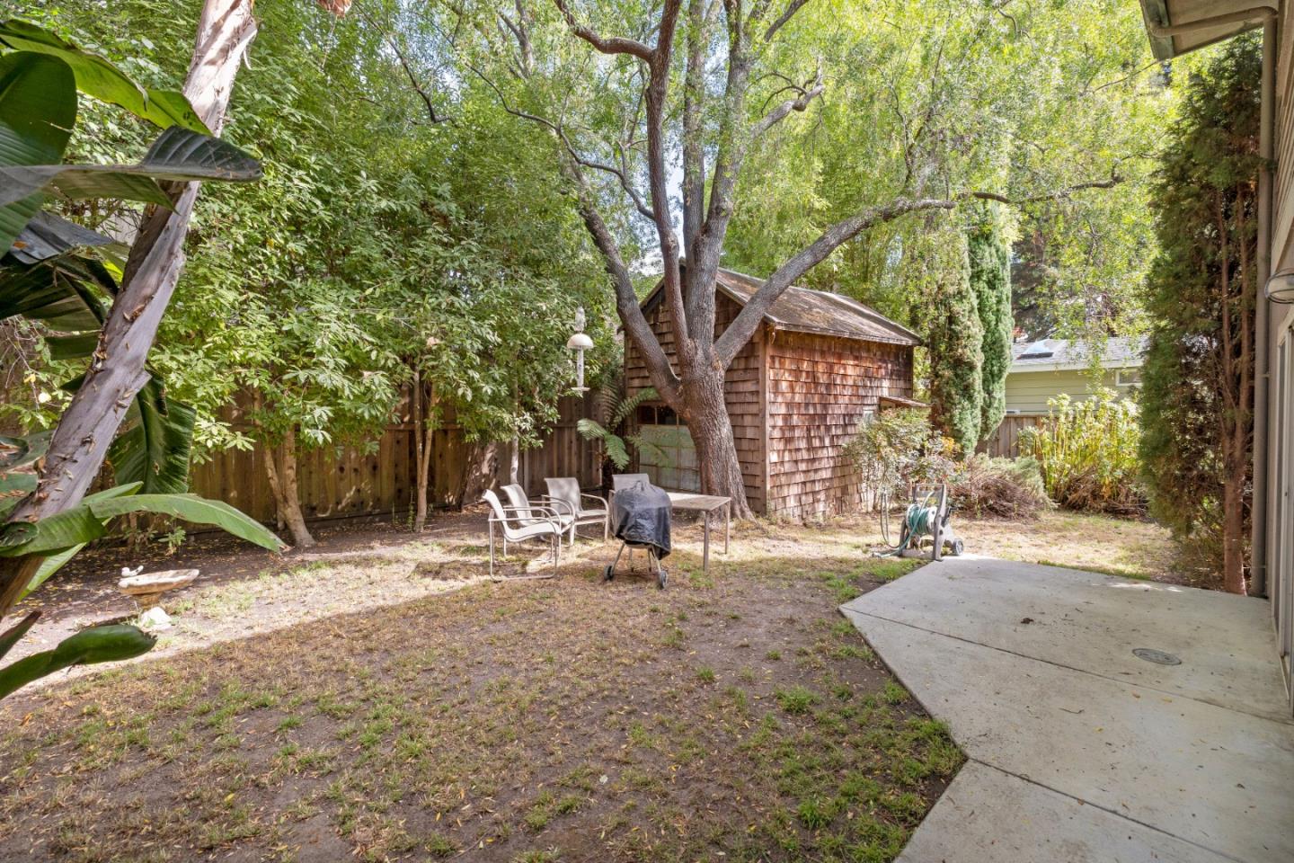 33 Edgewood Way Santa Cruz, CA 95060 - Photo 34 of 37 a backyard of a house with yard and outdoor seating