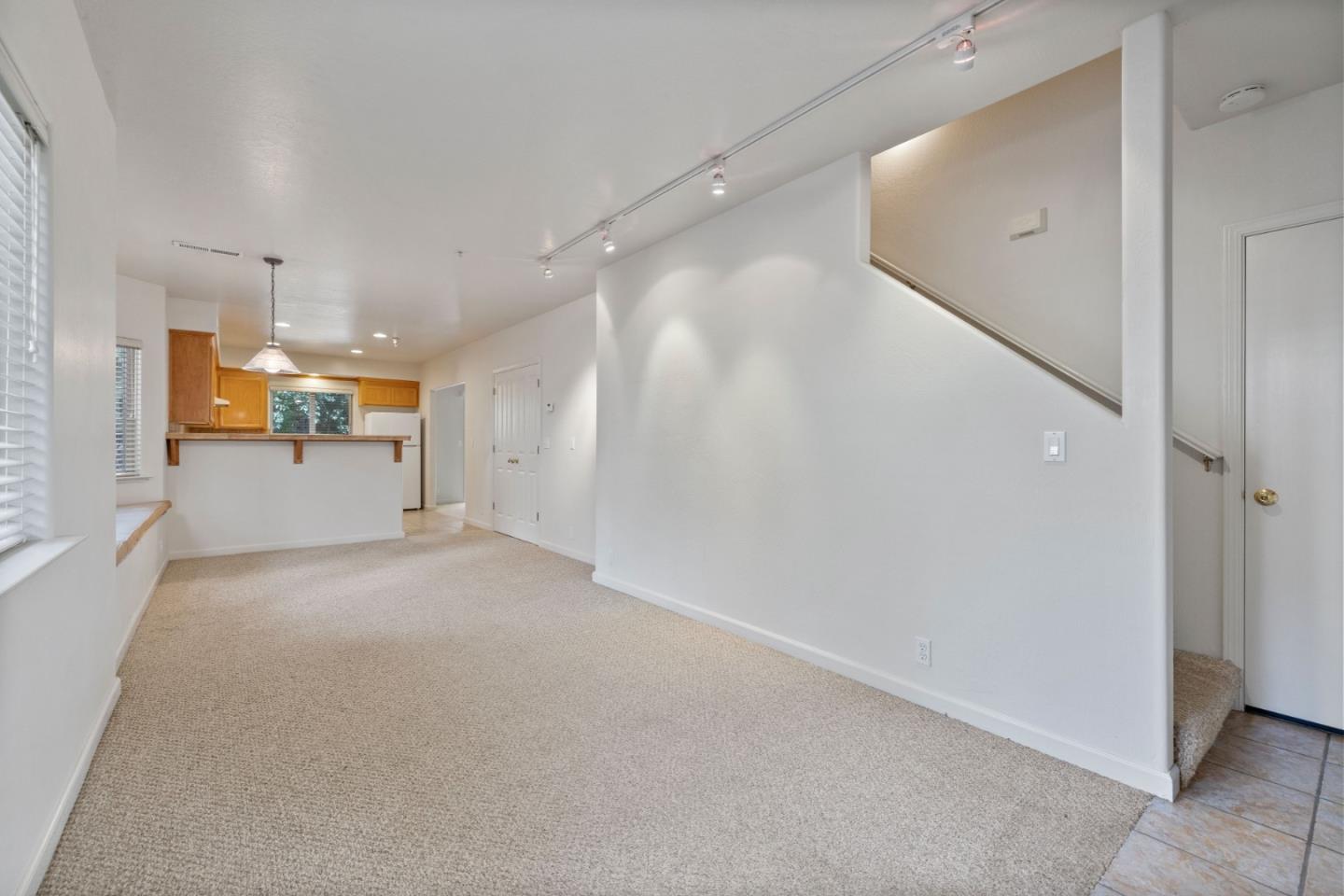 33 Edgewood Way Santa Cruz, CA 95060 - Photo 8 of 37 an empty room with a cabinet and mirrors