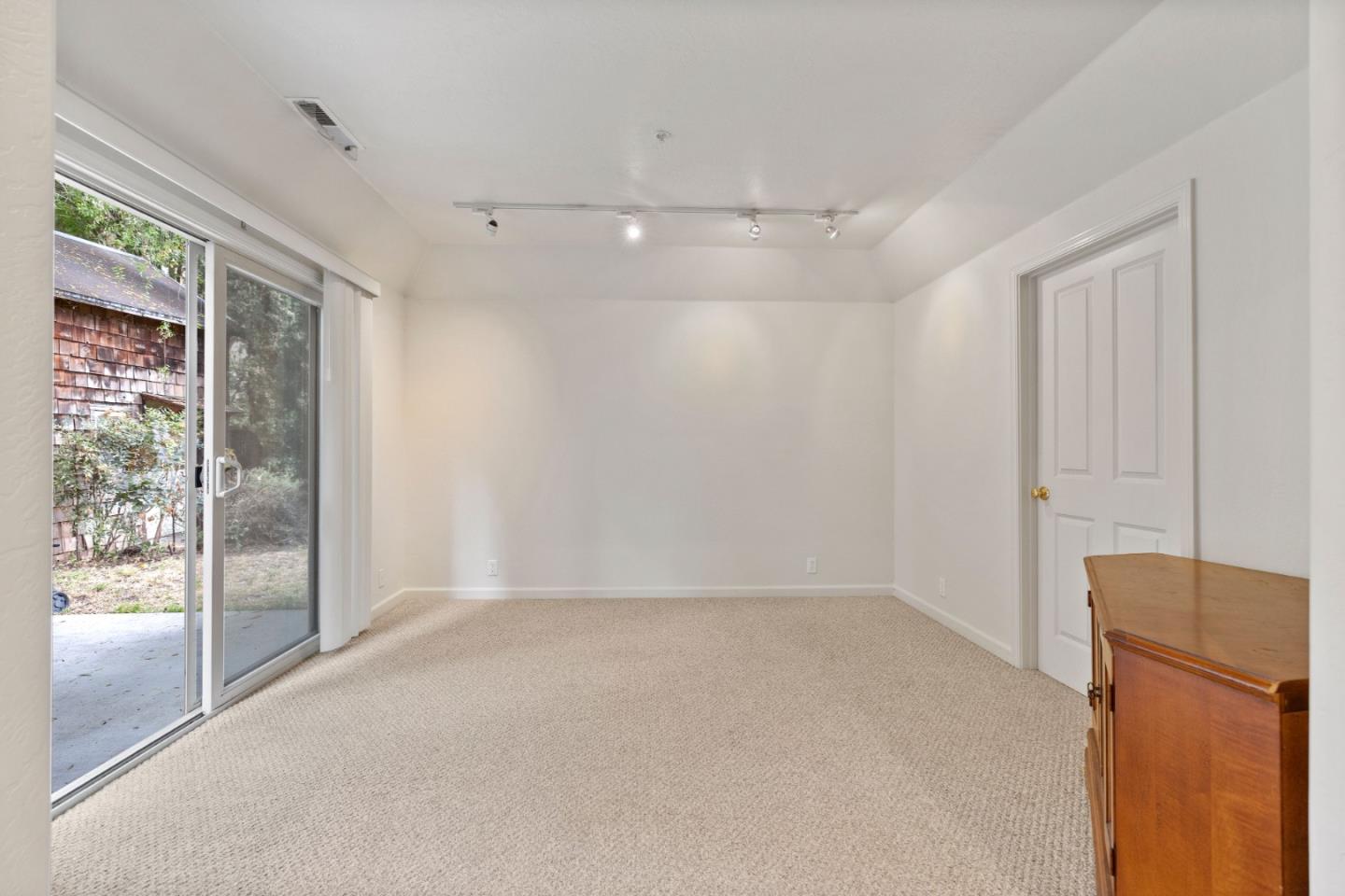33 Edgewood Way Santa Cruz, CA 95060 - Photo 9 of 37 wooden floor in an empty room with a window