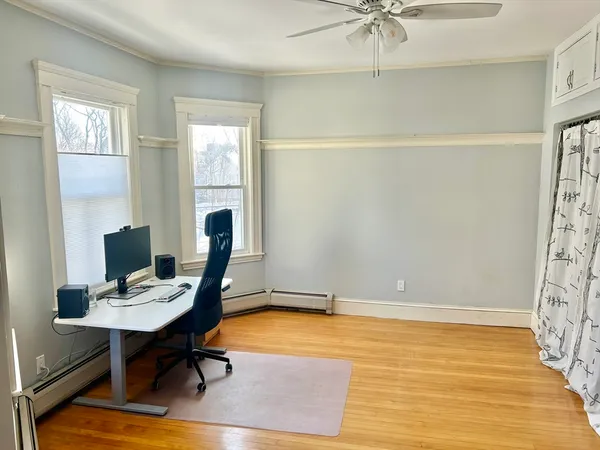 a workspace with furniture and a window