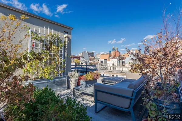 a view of a terrace with furniture