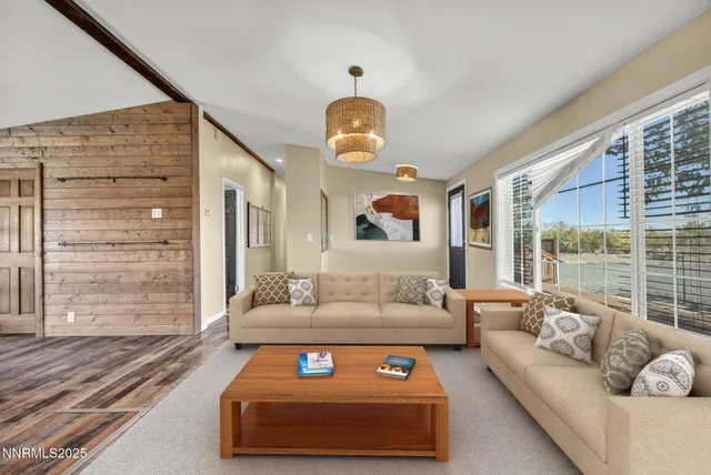 a kitchen with kitchen island a stove a sink and cabinets