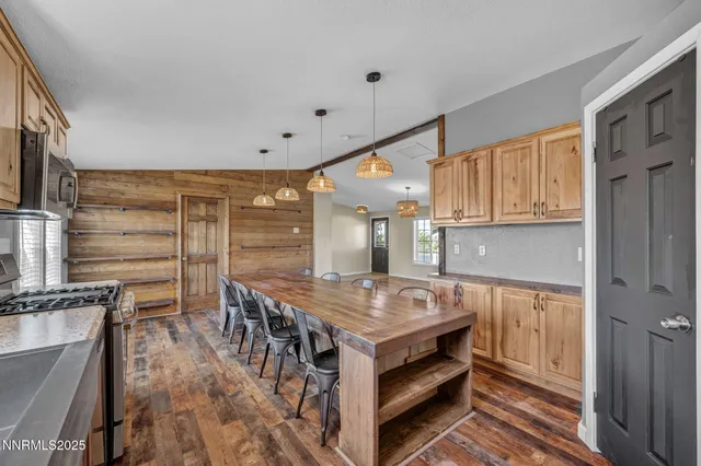 a kitchen with furniture a counter space cabinets and appliances