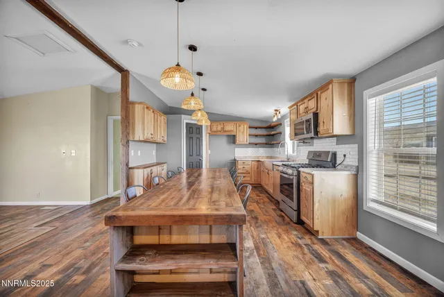 a view of a livingroom with furniture and chandelier