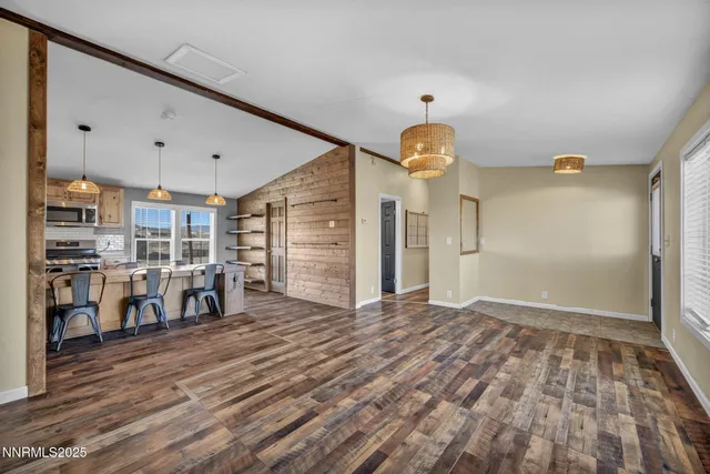 a kitchen with a stove cabinets and wooden floor