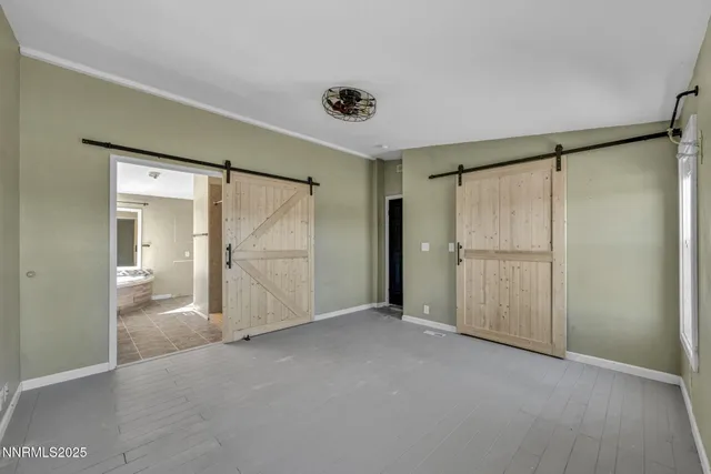 a spacious bathroom with a tub and a sink
