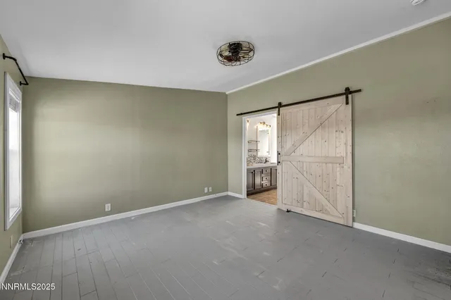 a bathroom with double vanity and a bathtub