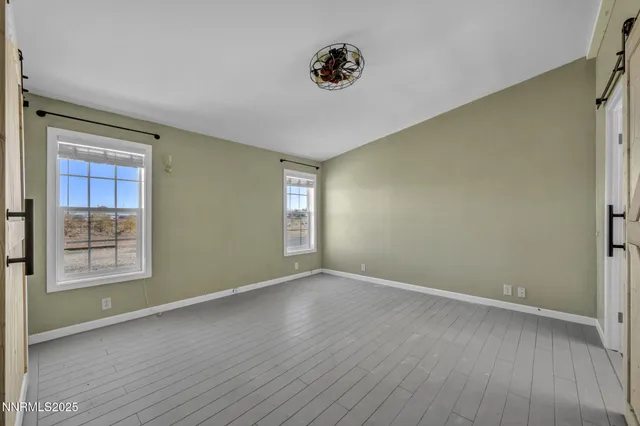 a large white tub sitting next to a white toilet