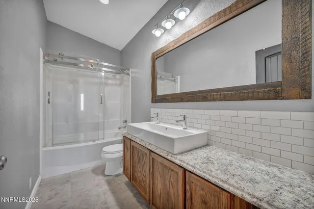 a living room with furniture potted plant and a window