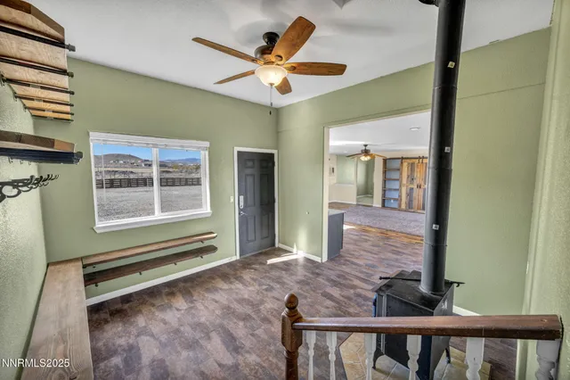 a view of livingroom with hardwood floor and ceiling fan