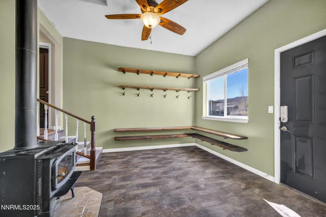 a view of livingroom with hardwood floor and a ceiling fan