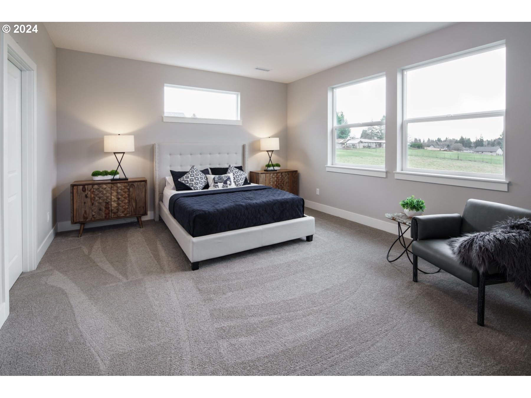 4219 North 11th Way Ridgefield, WA 98642 - Photo 20 of 32 a spacious bedroom with a bed and a window