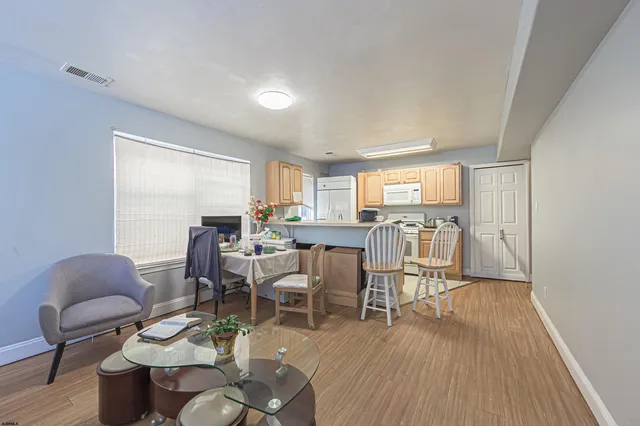 a kitchen with granite countertop a sink stove and refrigerator