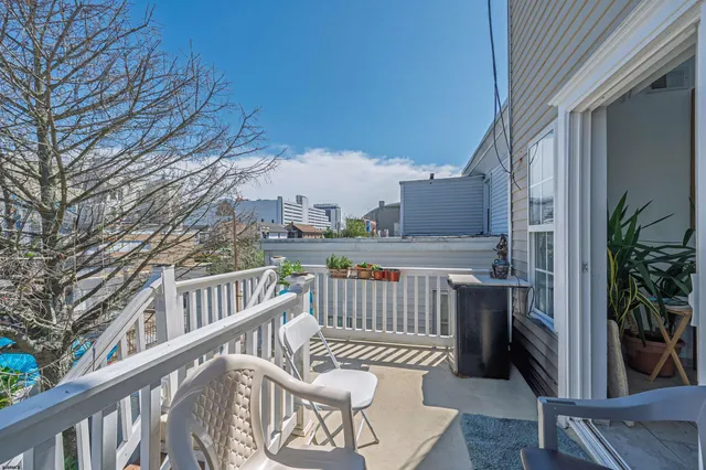 a view of balcony with furniture
