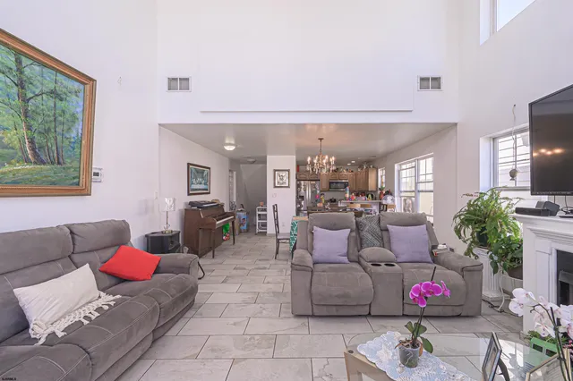 a living room with furniture and flowers