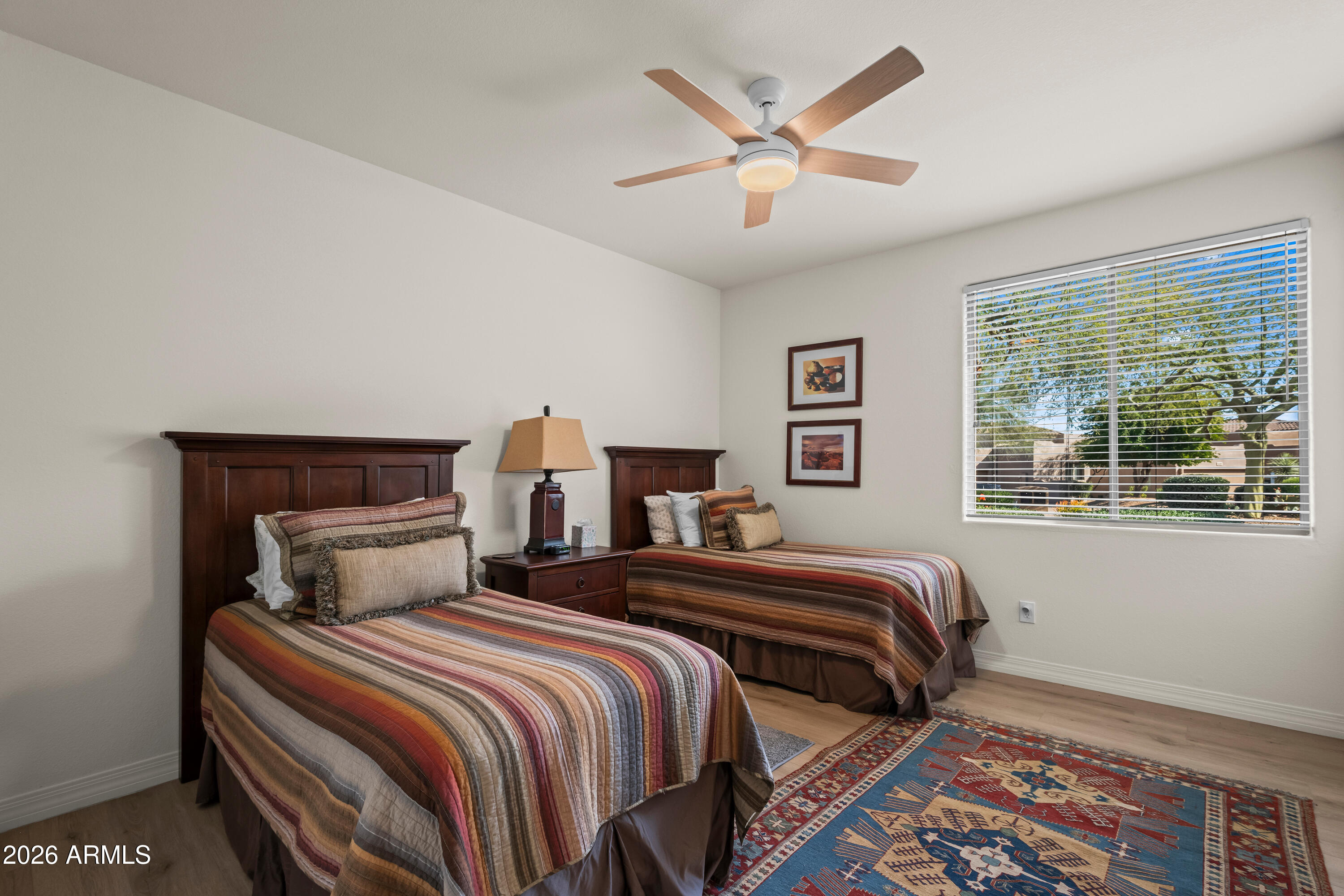 27504 North Montana Drive Rio Verde, AZ 85263 - Photo 24 of 32 a bedroom with two beds and a large window