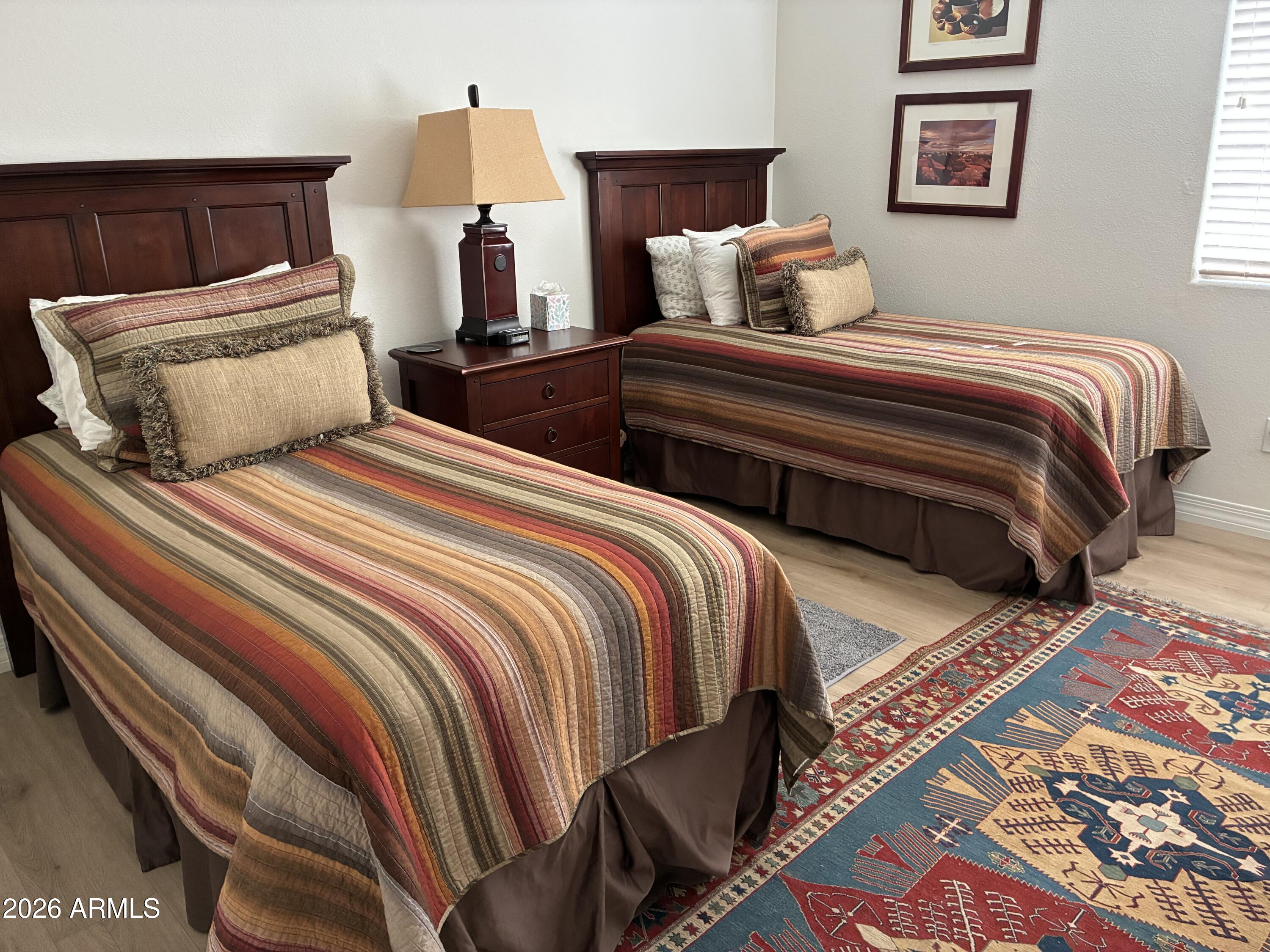 27504 North Montana Drive Rio Verde, AZ 85263 - Photo 25 of 32 a bedroom with two beds and painting on the wall